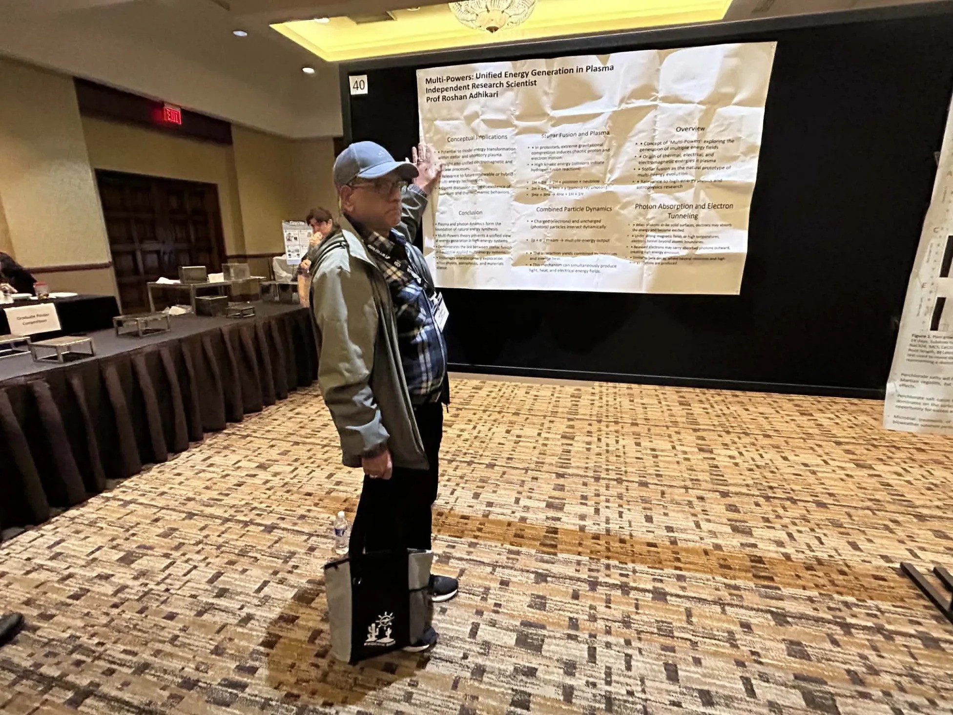 Professor Roshan Adhikari giving a poster presentation at a NASA ASGSR convention.